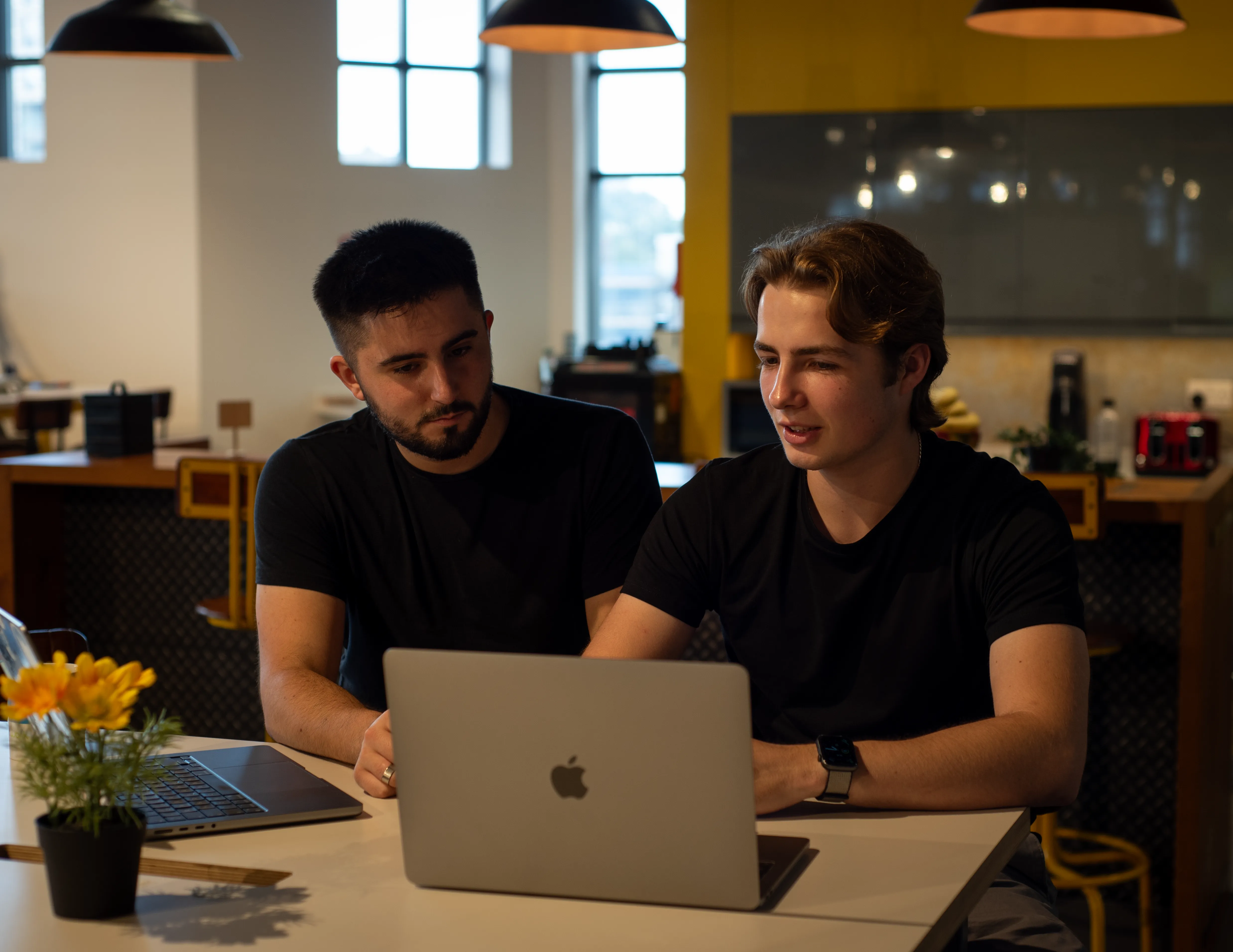 James and John working on a project